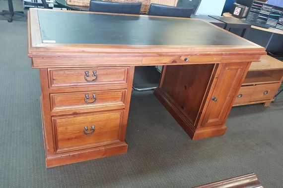 solid wooden desk with leather top three drawers and side cupboard